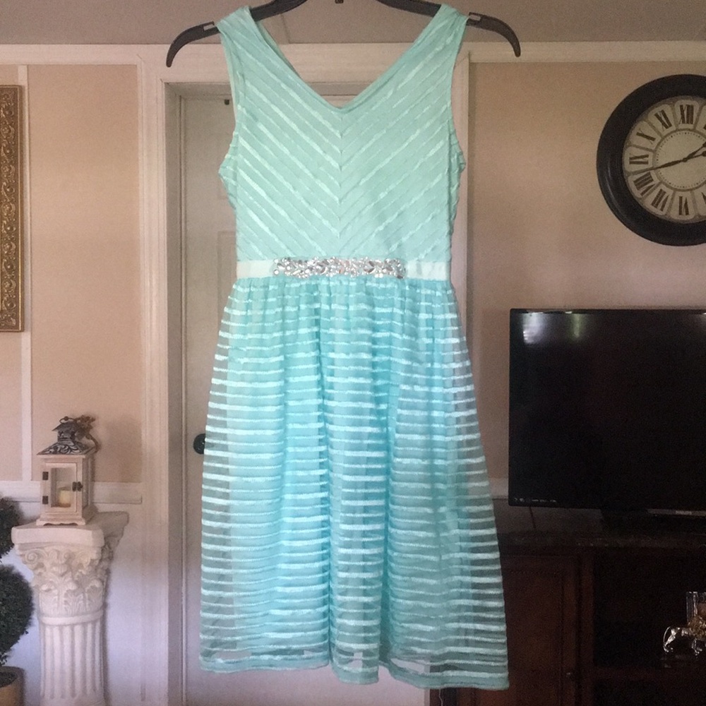 Teal, diamonds, ties up in back,perfect condition!